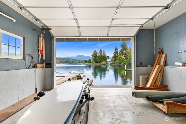 garage featuring radiator and a water and mountain view