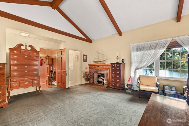 sitting room featuring dark carpet, a brick fireplace, and lofted ceiling with beams