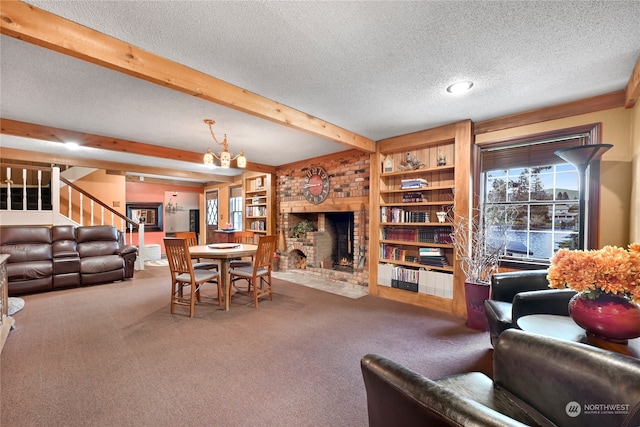 carpeted living room with a textured ceiling, a brick fireplace, a chandelier, and beamed ceiling