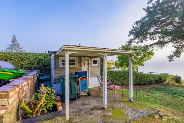 view of outdoor structure with a yard and a rural view