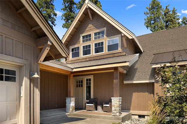 exterior space with a shingled roof and board and batten siding