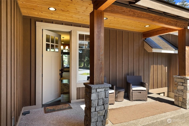 view of exterior entry featuring board and batten siding