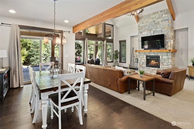 73 Sweet Shop Ln, Cle Elum, WA 98922 - dining area with a stone fireplace, beamed ceiling, wood finished floors, and a healthy amount of sunlight