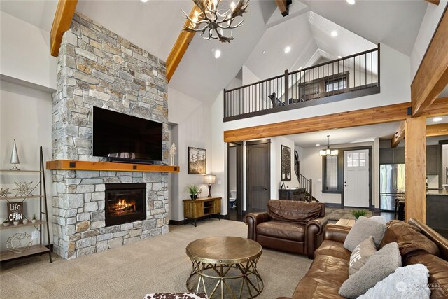 73 Sweet Shop Ln, Cle Elum, WA 98922 - carpeted living area featuring a chandelier, high vaulted ceiling, a stone fireplace, recessed lighting, and beamed ceiling