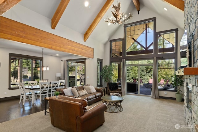 73 Sweet Shop Ln, Cle Elum, WA 98922 - living room with beamed ceiling, a healthy amount of sunlight, a fireplace, high vaulted ceiling, and a notable chandelier