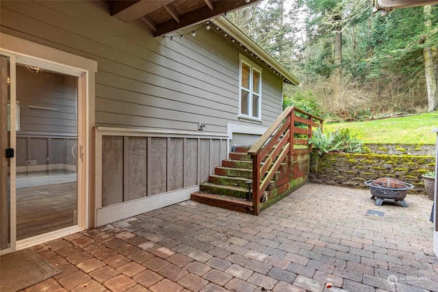 view of patio with a fire pit