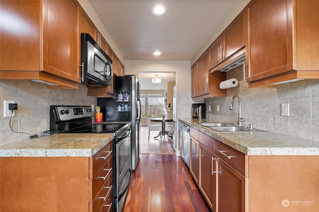 kitchen with backsplash, stainless steel appliances, dark hardwood / wood-style floors, and sink