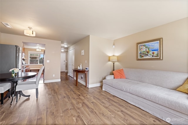 living room with light hardwood / wood-style floors