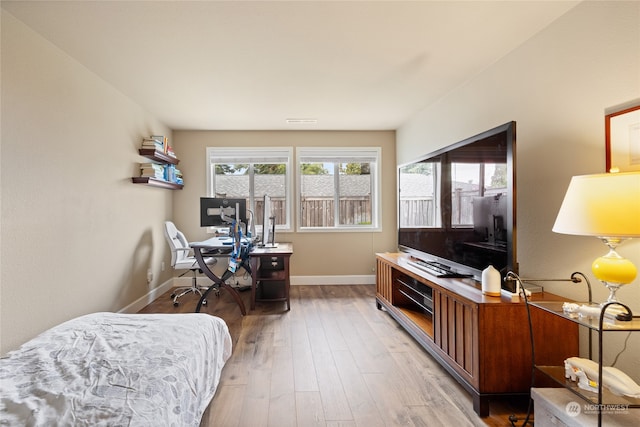 office with light wood-type flooring