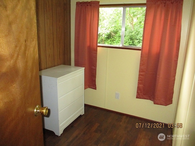 empty room featuring dark wood-type flooring