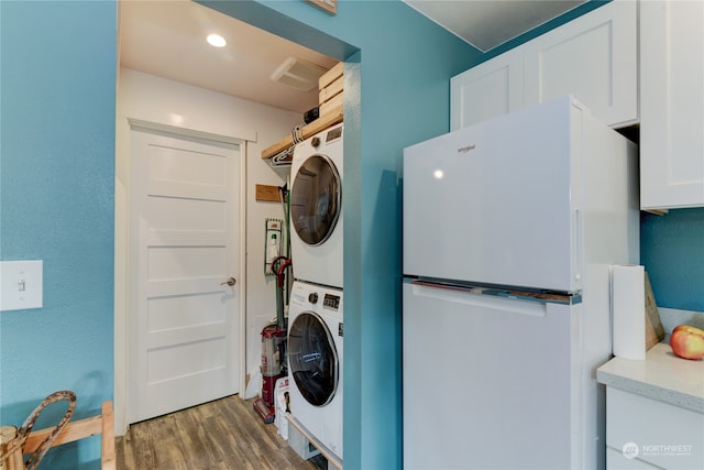 washroom featuring wood-type flooring and stacked washer and dryer