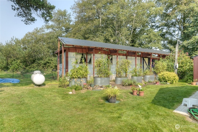 exterior space with a yard and an outdoor structure