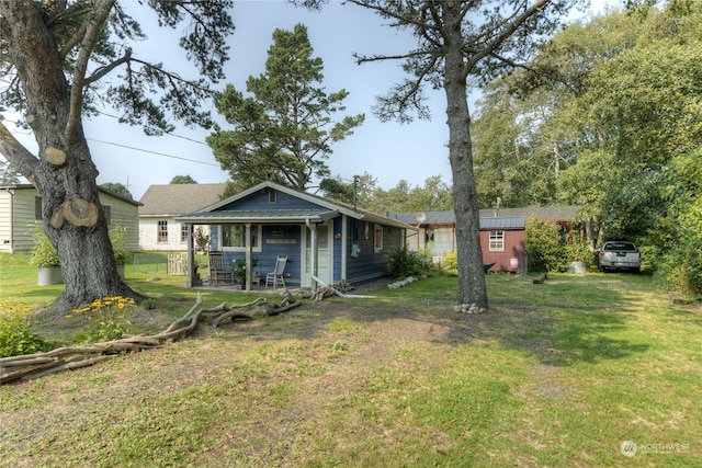 back of house with a yard