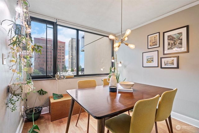 dining room with ornamental molding and hardwood / wood-style flooring