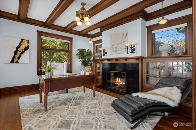 office area featuring beam ceiling, hardwood / wood-style flooring, and a fireplace