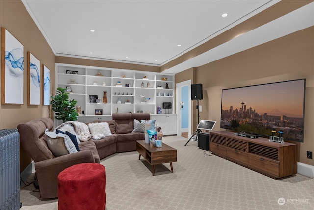 living room featuring ornamental molding and light colored carpet