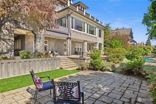 view of patio / terrace with a balcony