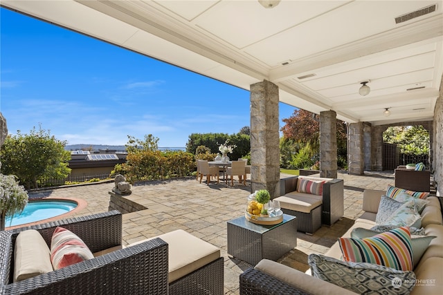 view of patio / terrace featuring an outdoor living space and a pool