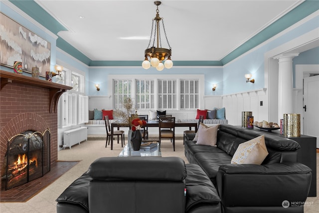 living room featuring crown molding, radiator, light carpet, and a brick fireplace