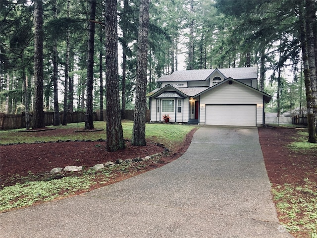 view of front facade featuring a garage and a front lawn