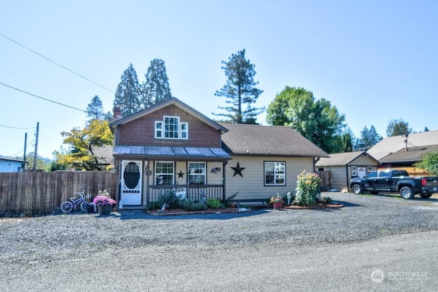 view of front of property with a garage and covered porch