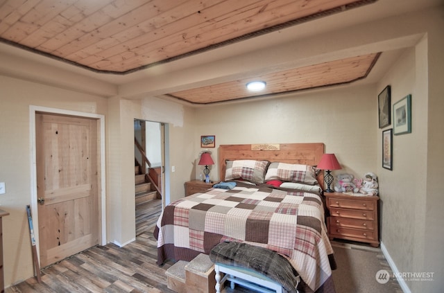 bedroom with wood ceiling and hardwood / wood-style flooring