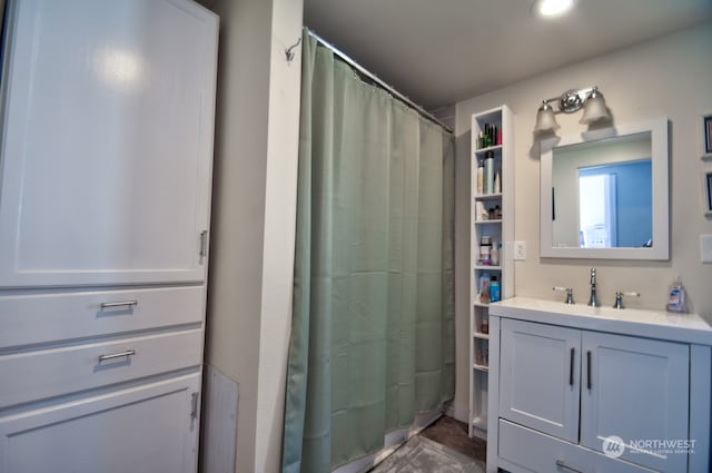 bathroom with vanity and walk in shower