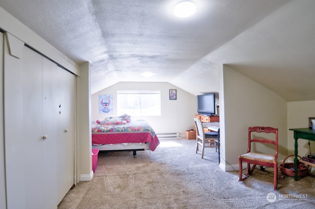 carpeted bedroom featuring vaulted ceiling, a textured ceiling, a baseboard radiator, and a closet