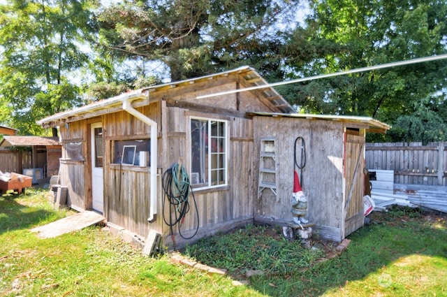 view of outbuilding with a yard