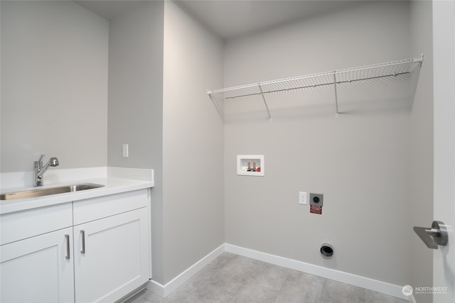 laundry area with hookup for an electric dryer, sink, washer hookup, and cabinets