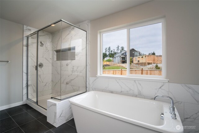 bathroom featuring independent shower and bath and tile patterned floors