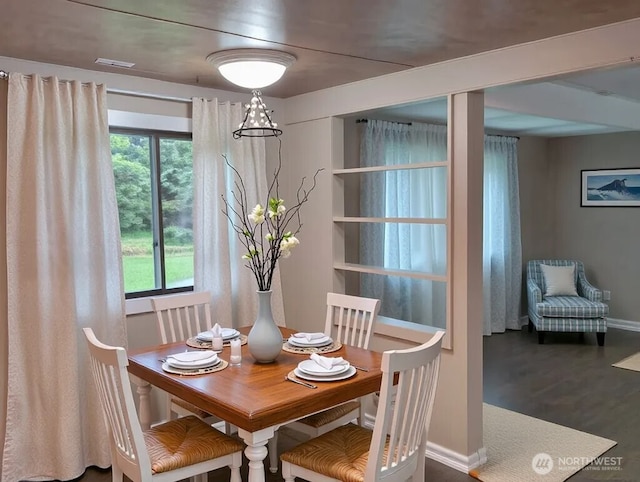 8 Griffard St, Copalis Beach, WA 98535 - dining room with healthy amount of natural light and dark wood-style flooring