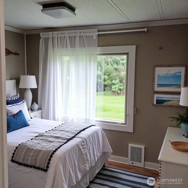 8 Griffard St, Copalis Beach, WA 98535 - bedroom featuring baseboards and wood finished floors