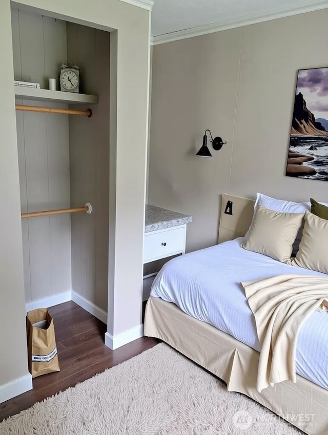 8 Griffard St, Copalis Beach, WA 98535 - bedroom with crown molding and dark wood-style floors