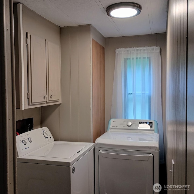 8 Griffard St, Copalis Beach, WA 98535 - laundry room with cabinet space and washing machine and dryer