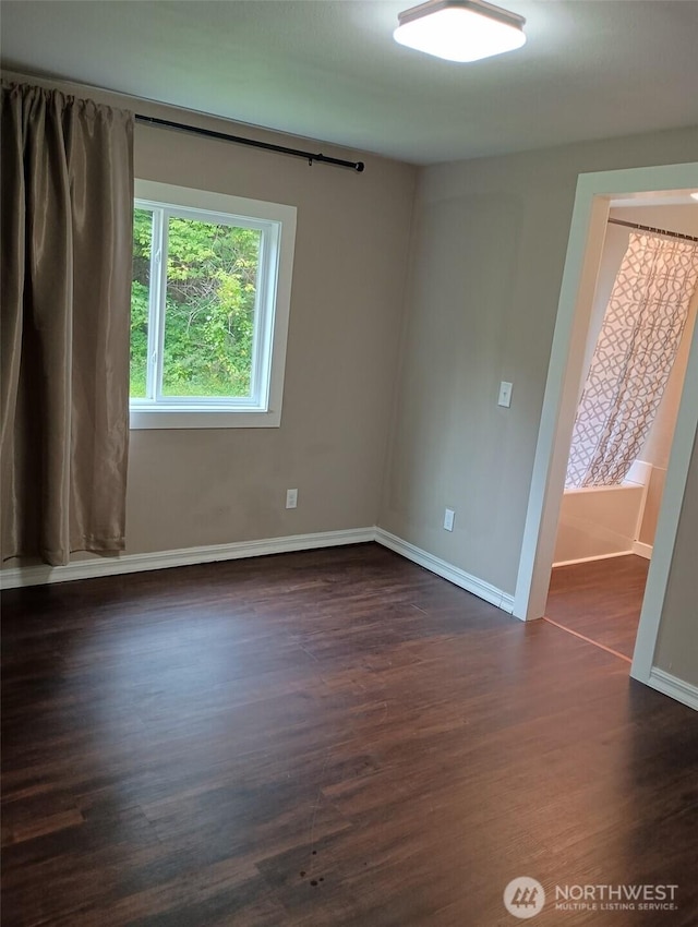 8 Griffard St, Copalis Beach, WA 98535 - empty room featuring dark wood-type flooring and baseboards