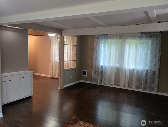 8 Griffard St, Copalis Beach, WA 98535 - spare room with beam ceiling, dark wood finished floors, and healthy amount of natural light