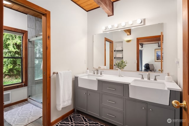 bathroom featuring vanity, plenty of natural light, wood ceiling, and a shower with door