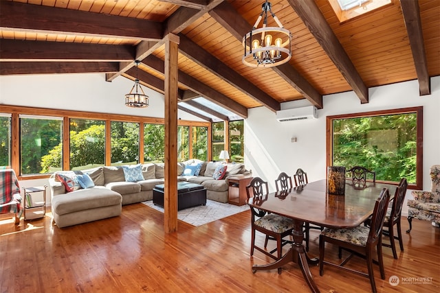 interior space with a wall mounted AC, wood ceiling, a wealth of natural light, and a chandelier