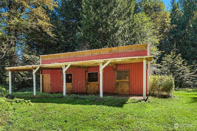 view of outdoor structure with a lawn