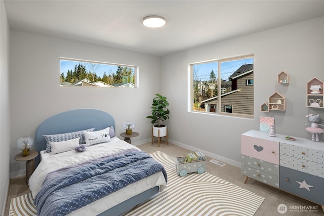 bedroom featuring visible vents, multiple windows, baseboards, and carpet flooring