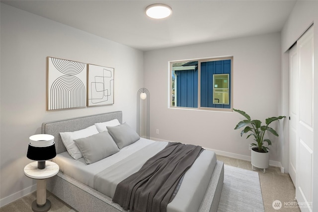 bedroom featuring a closet, baseboards, and carpet floors