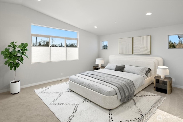 bedroom with multiple windows, carpet floors, and vaulted ceiling