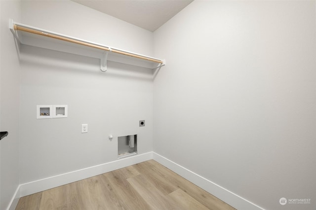 laundry room with hardwood / wood-style floors, hookup for an electric dryer, washer hookup, and hookup for a gas dryer