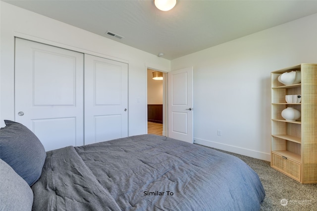 bedroom with a closet and carpet