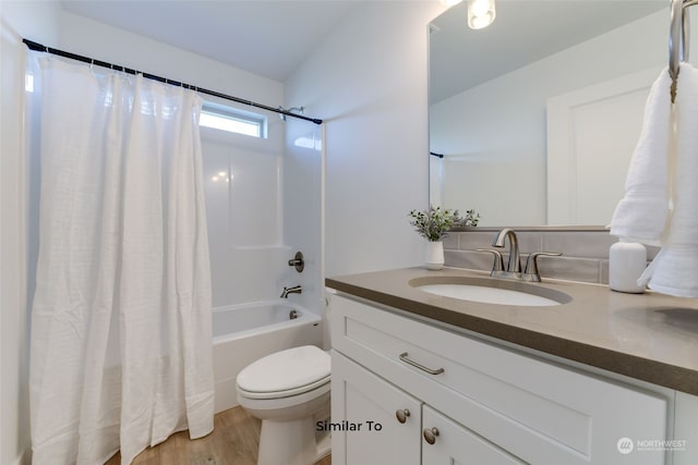 full bathroom with vanity, toilet, shower / tub combo, and wood-type flooring