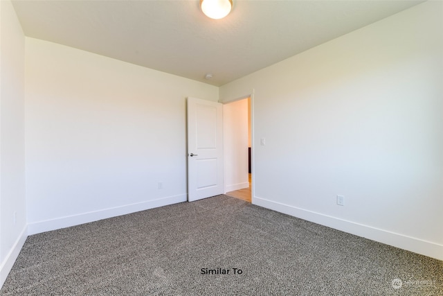 unfurnished room with carpet floors