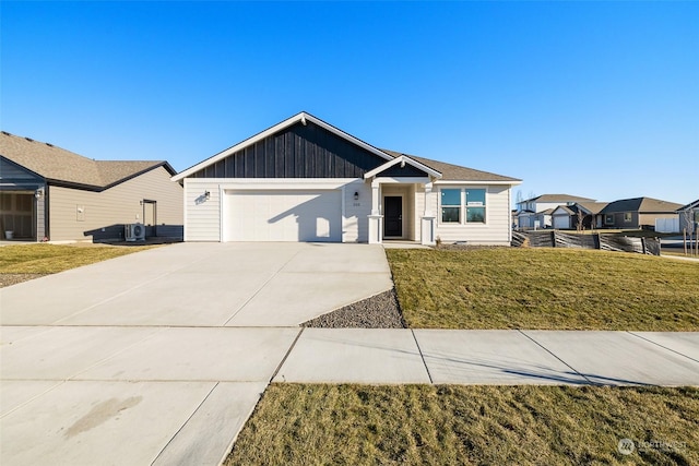 single story home with a garage and a front yard