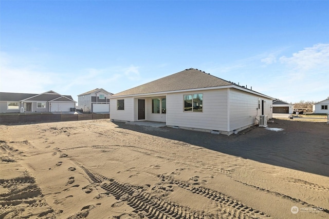 rear view of property with central air condition unit