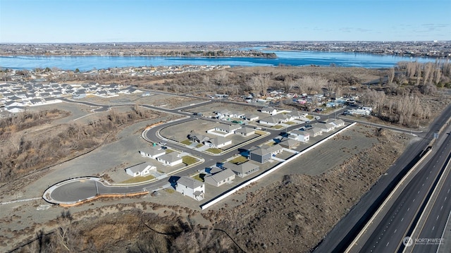 drone / aerial view featuring a water view